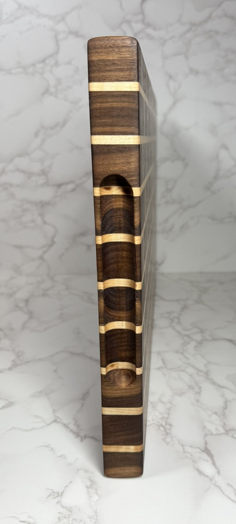 Brick & Mortar end grain cutting board showcasing Black Walnut and Maple pattern"