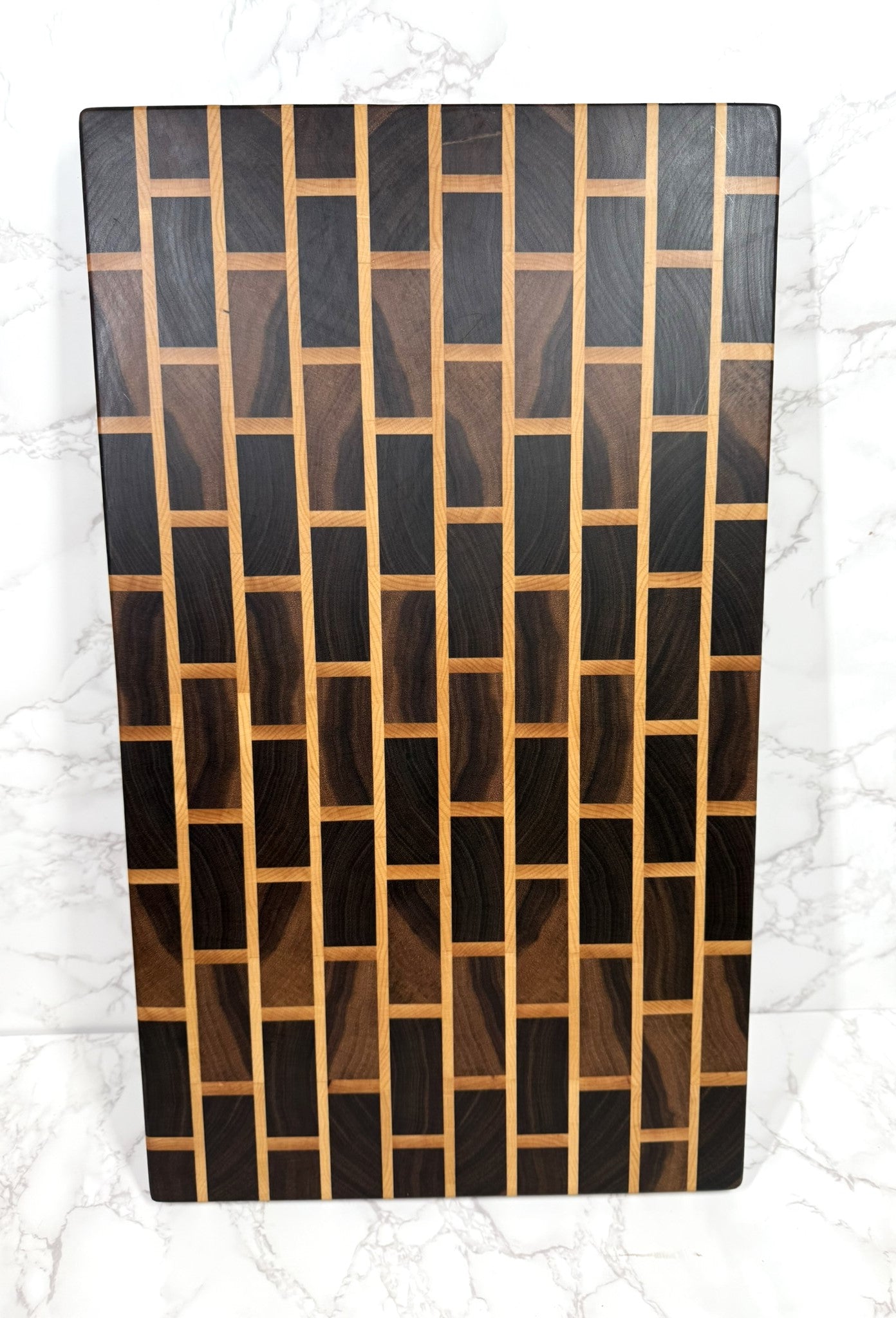 Brick & Mortar end grain cutting board showcasing Black Walnut and Maple pattern"
