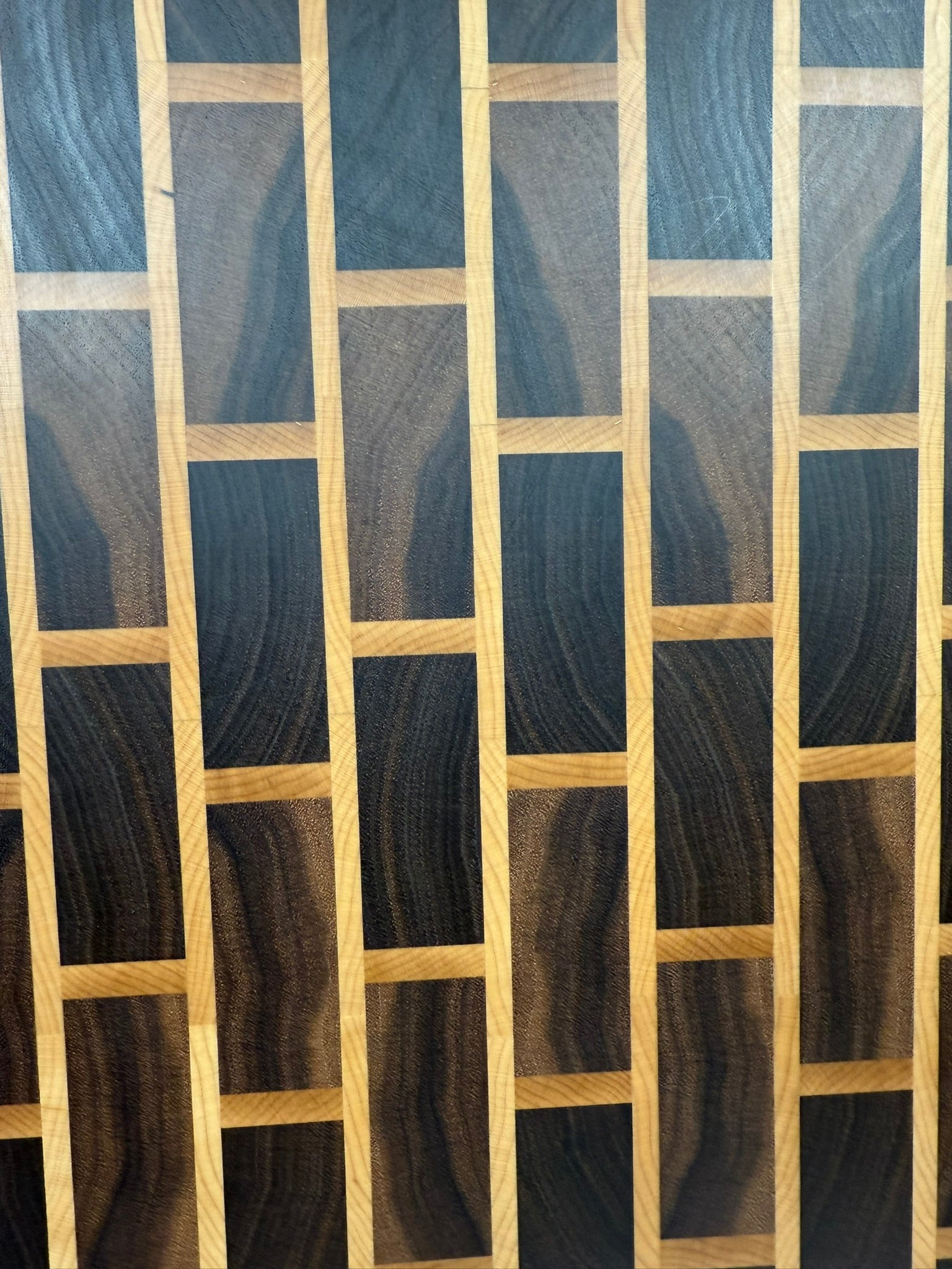 Brick & Mortar end grain cutting board showcasing Black Walnut and Maple pattern"