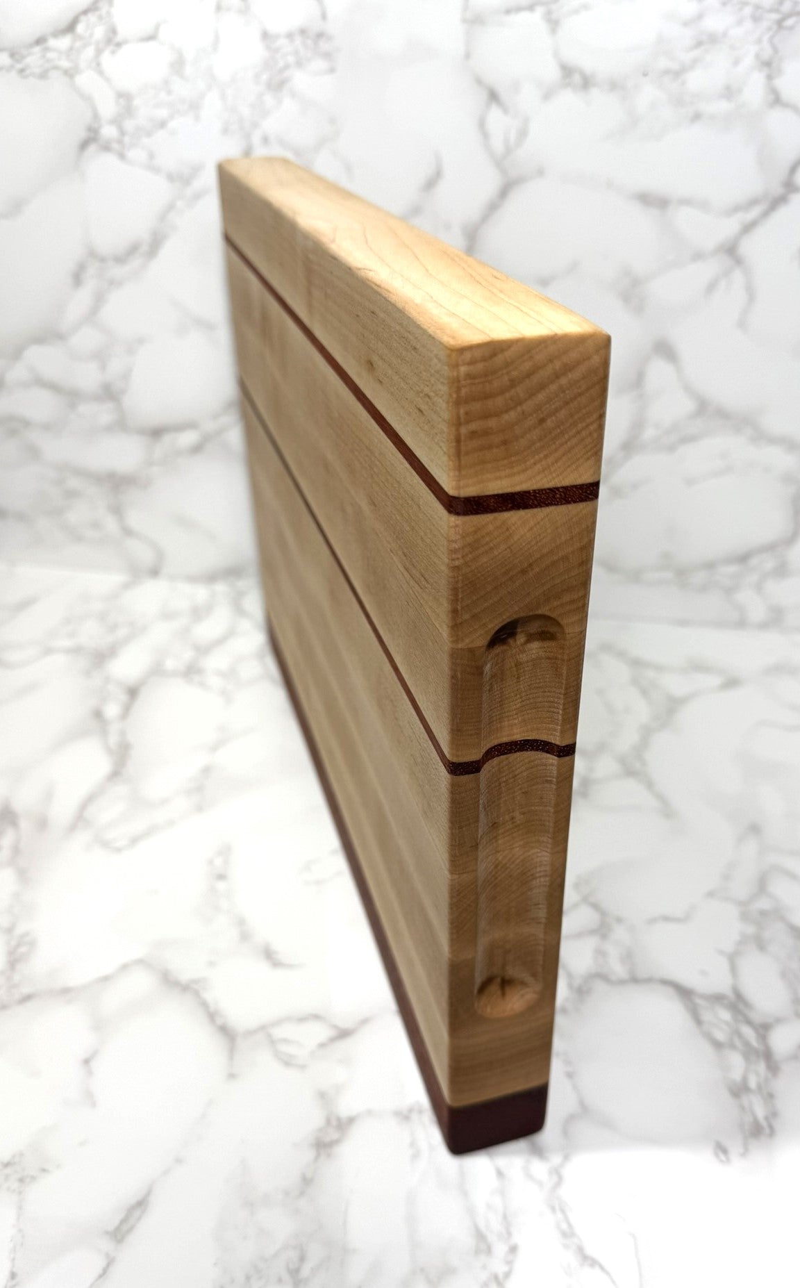 Maple, with thin stripe of Padauk Edge Grain Cutting board 14x10x1.25"