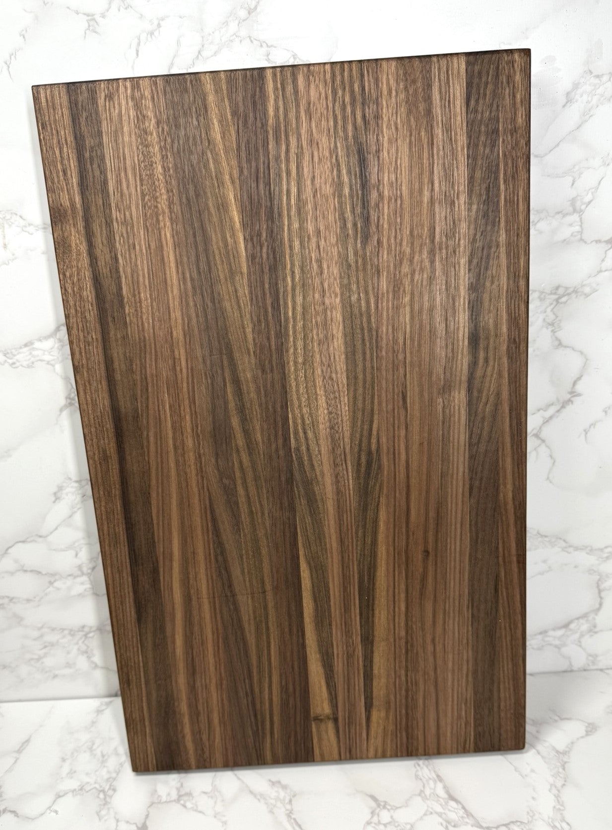 "Premium Black Walnut Edge Grain Cutting Board showcasing rich wood grain and craftsmanship"