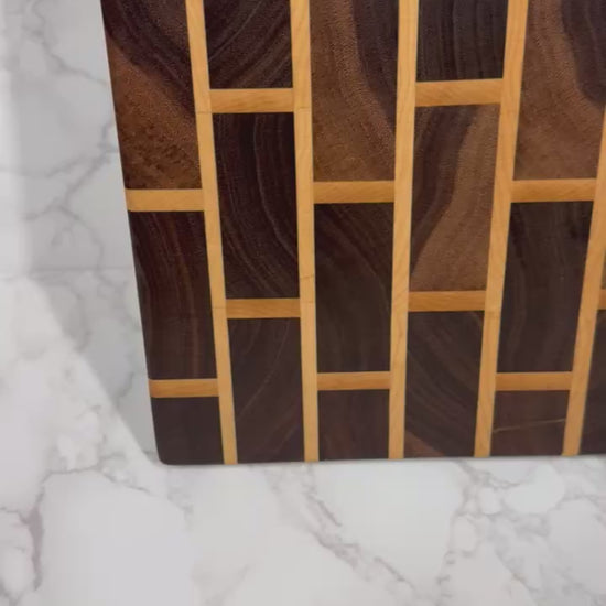 Brick & Mortar end grain cutting board showcasing Black Walnut and Maple pattern"