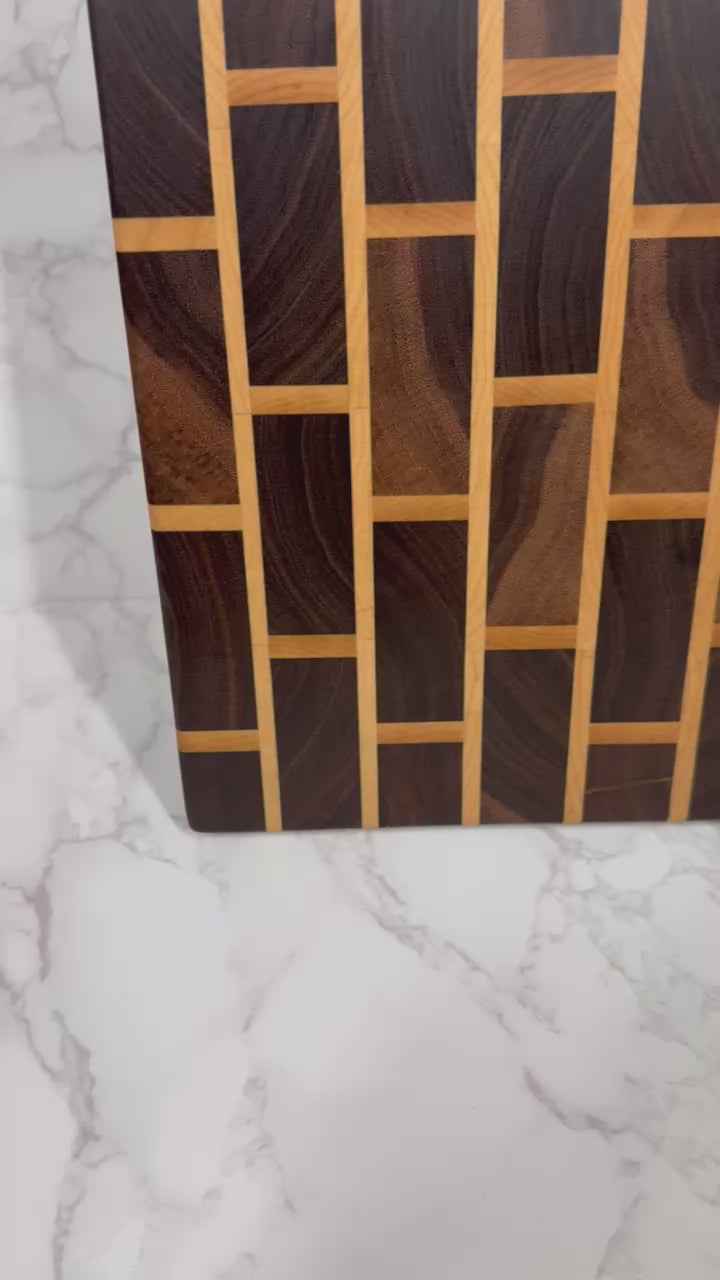 Brick & Mortar end grain cutting board showcasing Black Walnut and Maple pattern"